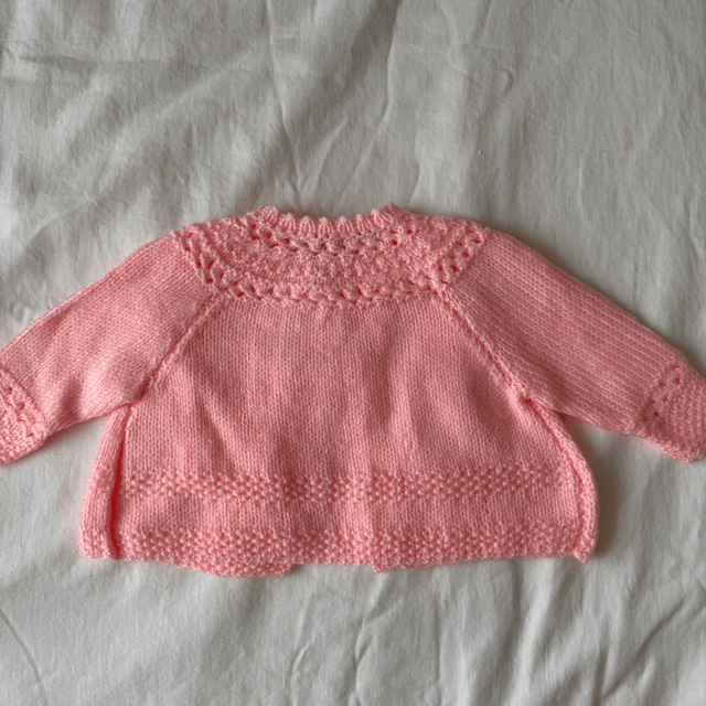 Pink knitted baby matinee jacket 