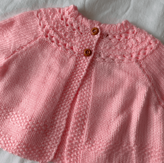 Pink knitted baby matinee jacket 
