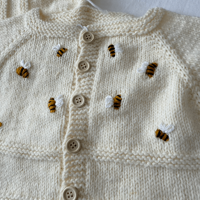 Cream knitted cardigan with bumblebee embroidery and matching hat