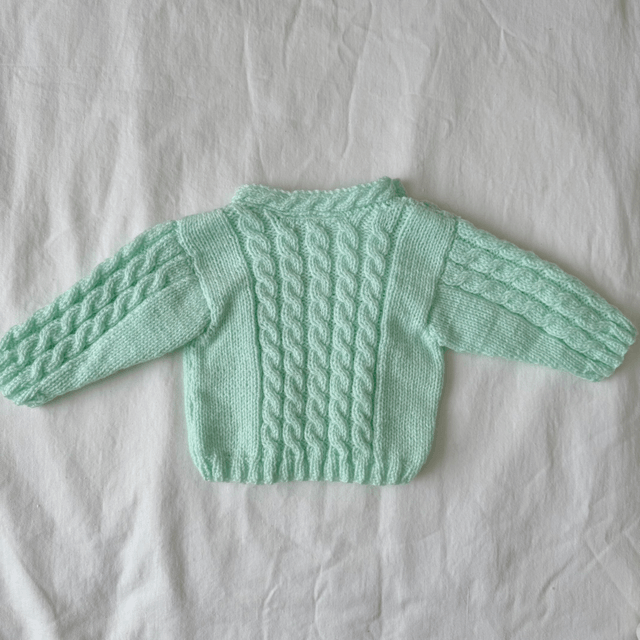 Green cable knit jumper