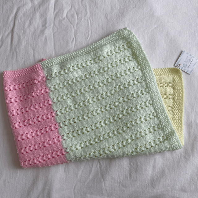 Pastel rainbow pointelle knitted buggy blanket