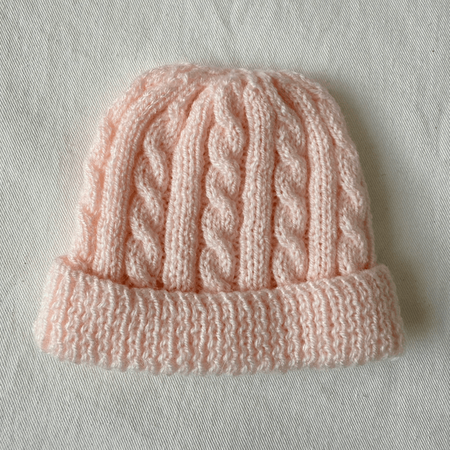 Pink cable knit hat