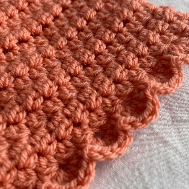 Coral crochet matinee jacket