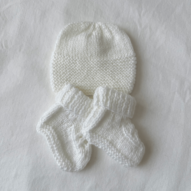 White knitted hat and booties set