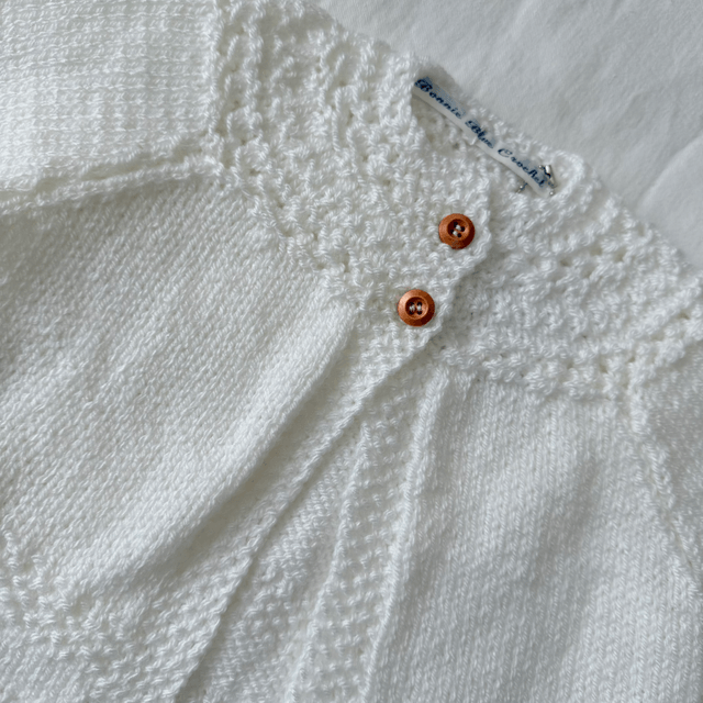 White knitted baby matinee jacket