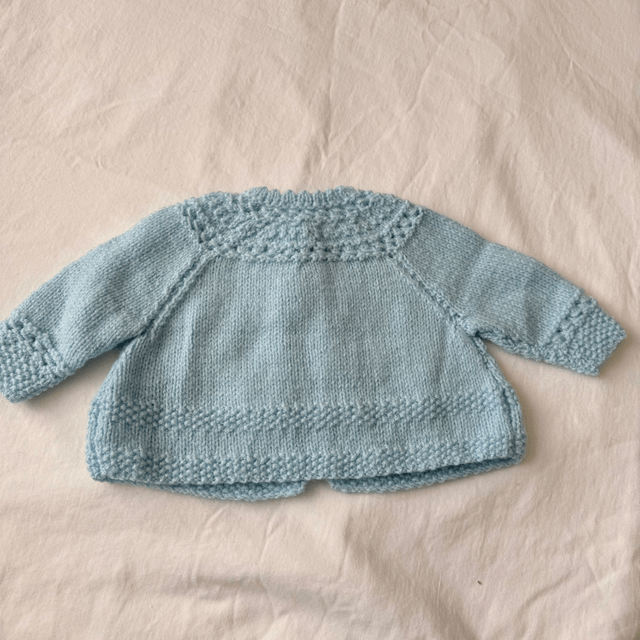 Blue knitted baby matinee jacket