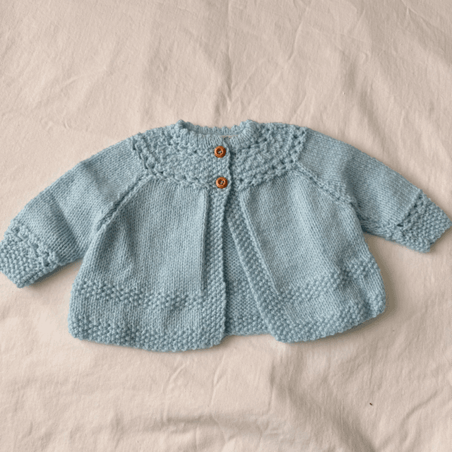 Blue knitted baby matinee jacket