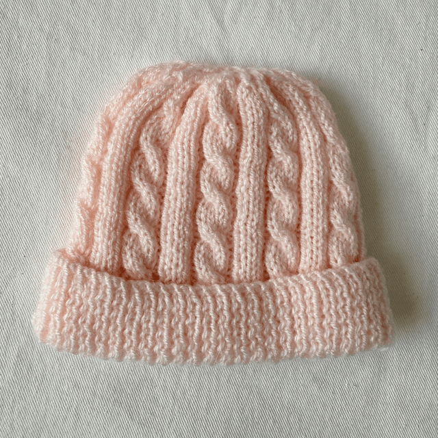 Pink cable knit hat